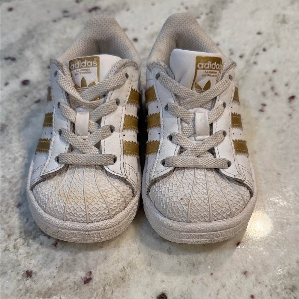 Adidas Superstars Kids' White and Gold Striped Sneakers